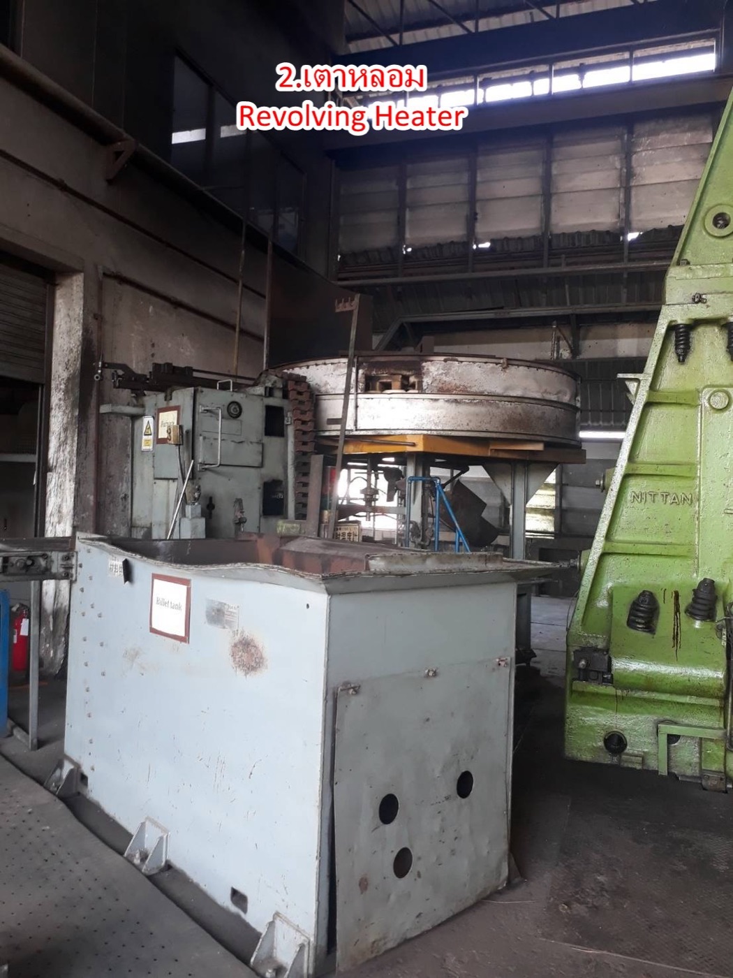 Revolving heating furnace with billet tank